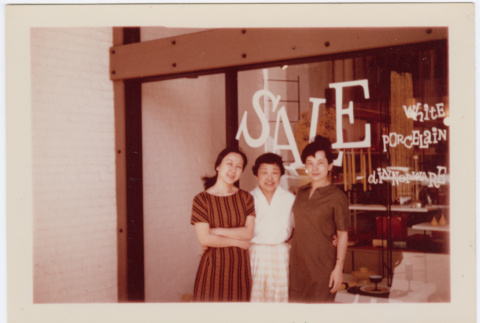 Three women standing in front of window display (ddr-densho-426-834)