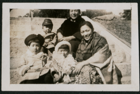 Women and children pose on steps (ddr-densho-359-974)
