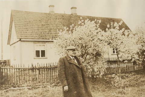Man in front of a house (ddr-njpa-1-2437)