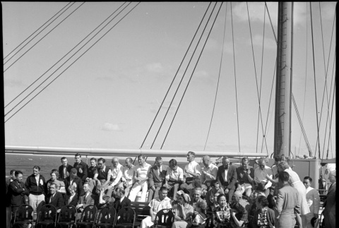 Group of passengers and crew on board ship (ddr-densho-426-264)