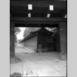 Woman walking along walkway (ddr-densho-426-2339)