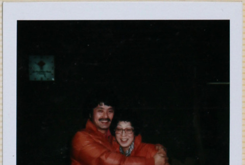 Couple in orange jackets (ddr-densho-426-1245)
