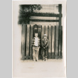 Two boys standing by fence (ddr-densho-426-1132)