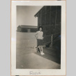 Woman on a barracks porch (ddr-manz-10-46)
