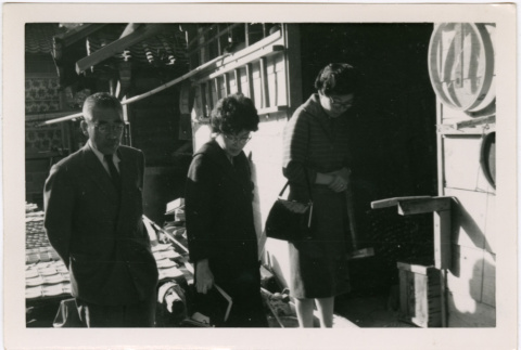 Tomoye Takahashi with unknown man and woman outside building (ddr-densho-426-1109)