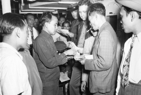 Indonesian deportees changing currency (ddr-csujad-27-5)