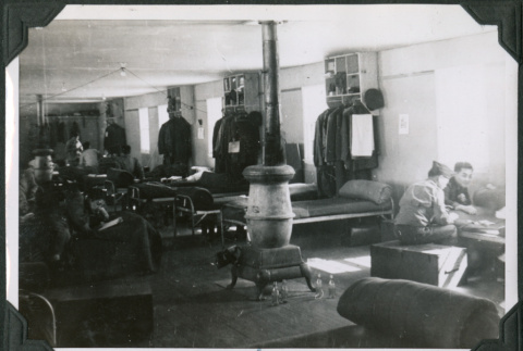 View of barracks with cots and wood stove (ddr-ajah-2-530)