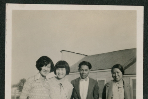 3 women and 1 man in a yard (ddr-densho-378-380)