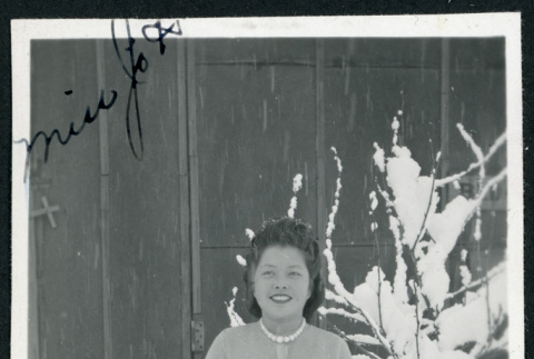 Photograph of Mitzie standing in the snow at Manzanar (ddr-csujad-47-267)