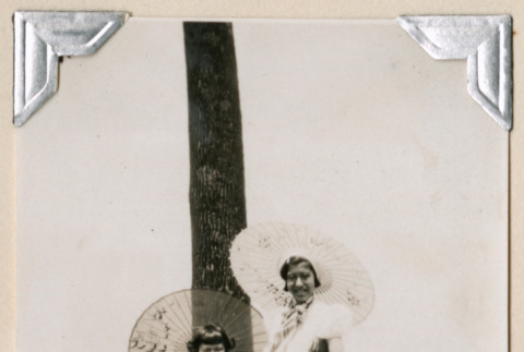 Woman and girl with parasols (ddr-densho-383-115)