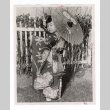 Vicki Ikeguchi, 4 years old, wearing kimono and twirling a parasol (ddr-csujad-52-8)
