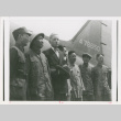 Servicepeople standing front of plane (ddr-densho-1007-178)