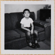 William Shiomi sitting on couch (ddr-densho-522-188)