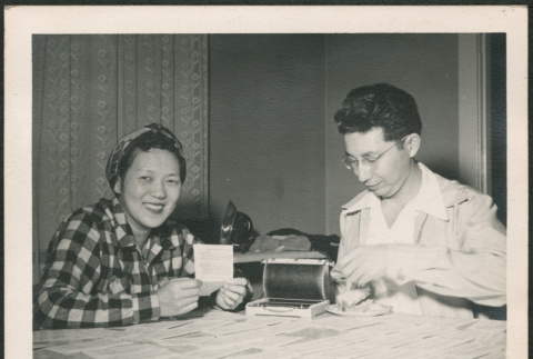 Couple sitting at table (ddr-densho-293-152)