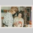 Tomoye Takahashi with unknown woman by product display (ddr-densho-426-1093)
