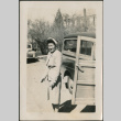 Woman standing next to truck (ddr-densho-316-425)