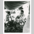 Two soldiers under a tarp (ddr-densho-1007-299)