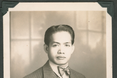 Portrait of a man in a pinstriped suit (ddr-densho-483-330)
