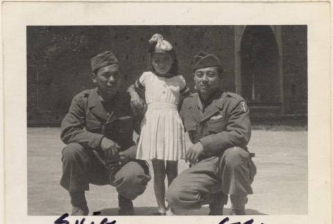 Two men posing with young girl (ddr-densho-466-399)
