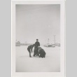 Three people playing in the snow (ddr-manz-7-77)