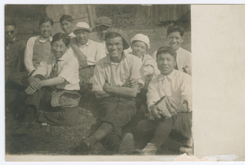 Group of men and boys seated outdoors (ddr-densho-383-418)