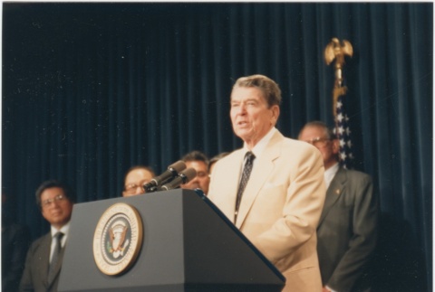 President Ronald Reagan speaking at the signing of the Civil Liberties Act of 1988 (ddr-densho-10-177)