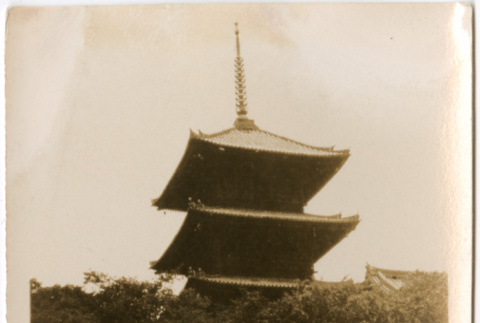 Four people on steps of large pagoda (ddr-densho-426-1527)