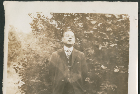Man standing in garden (ddr-densho-483-515)