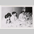 Skyliners band members sit at a banquet table (ddr-sbbt-3-157)