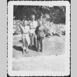 Man in uniform standing with man and woman (ddr-densho-434-407)