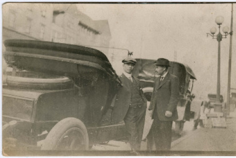 Two men next to a car (ddr-densho-351-19)