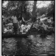 Japanese Americans resting near creek (ddr-densho-151-399)