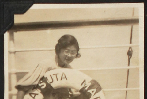 Tomoye (Nozawa) Takahashi with life ring (ddr-densho-423-532)