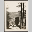 Man leaning against Balanced Rock (ddr-densho-433-1181)