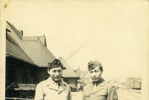 Two soldiers at a train station (ddr-densho-22-376)