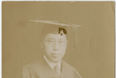Photo of Gentaro Takahashi in graduation robes (ddr-densho-355-94)