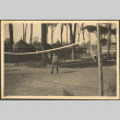 Man standing by volleyball net (ddr-densho-466-34)