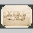 Photo of large group of men at a beach (ddr-densho-483-225)