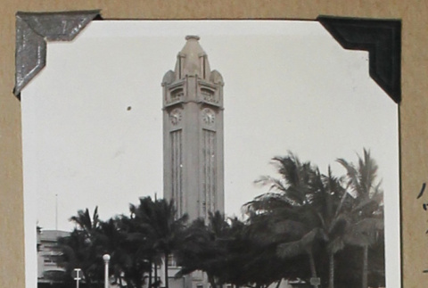 Clock tower rises above an intersection (ddr-densho-404-270)