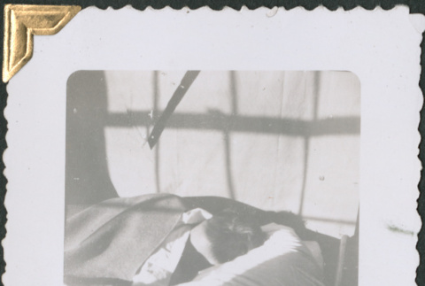 Man asleep on cot (ddr-densho-434-95)