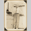 Dr. De Harr at a counter (ddr-densho-542-564)