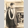 Young man wearing leis (ddr-njpa-4-2243)
