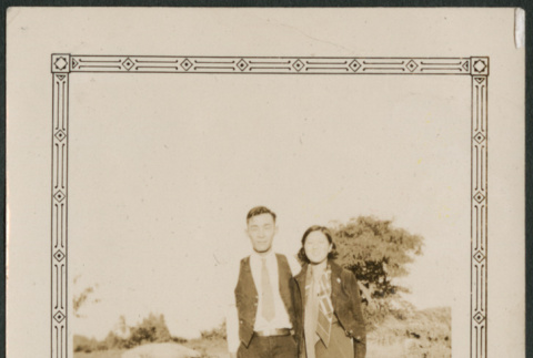 Couple standing on lawn (ddr-densho-316-233)