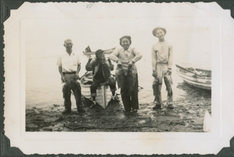 A group holding fish (ddr-densho-321-981)