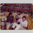 Three men by product display shelves (ddr-densho-426-1227)