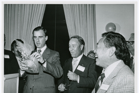 Jerry Brown being gifted a giant fortune cookie (ddr-densho-499-28)