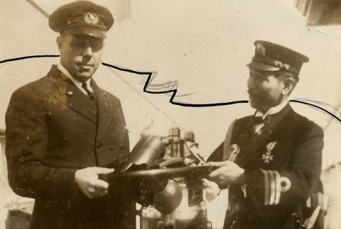 Commander Katsuhira Nakamura presenting a gift to Captain Ole Jorgensen (ddr-njpa-1-532)