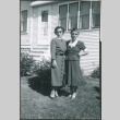 Two women outside house (ddr-densho-523-238)