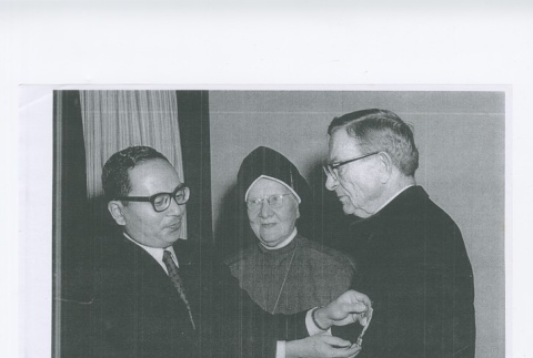 (Photograph) - Image of medal ceremony with priest, nun and man (ddr-densho-330-299-master-4c20a39127)