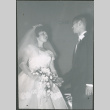 Bride and groom holding hands (ddr-densho-523-345)